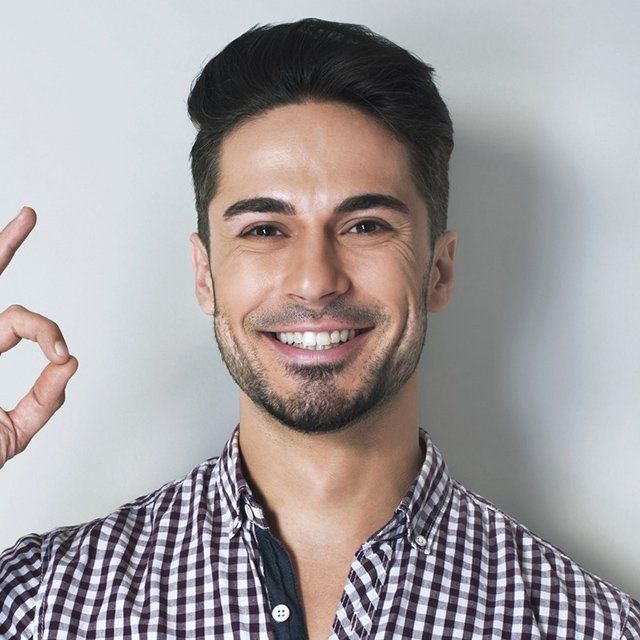 Man smiling, making 